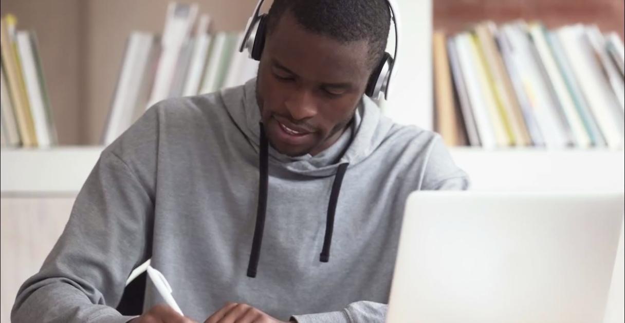 Professional analyzing financial data and reports at desk